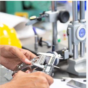 Technician performing dimensional calibration at Caltech