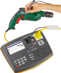 Technician performing PAT testing on portable electrical appliances in Sharjah